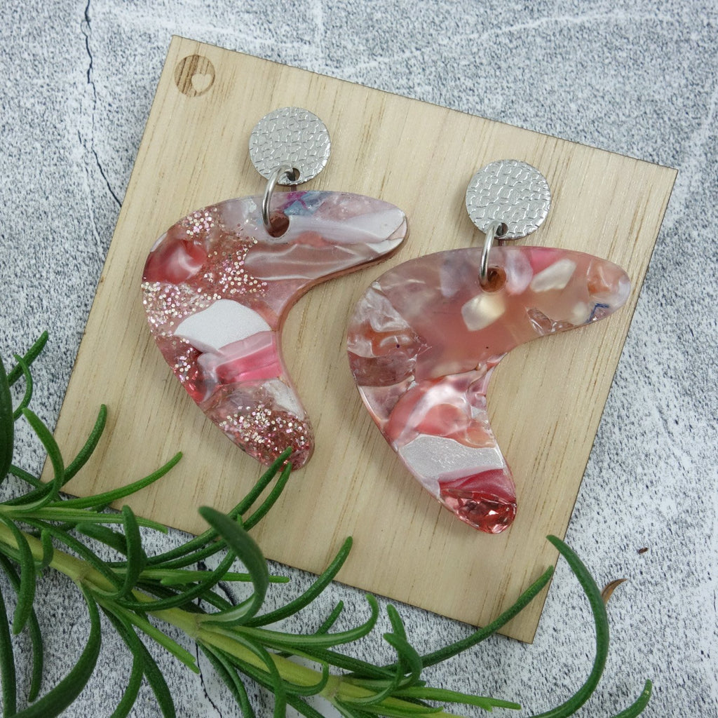 Mid century curve shaped one-of-a-kind recycled acrylic earrings with stainless steel toppers. 