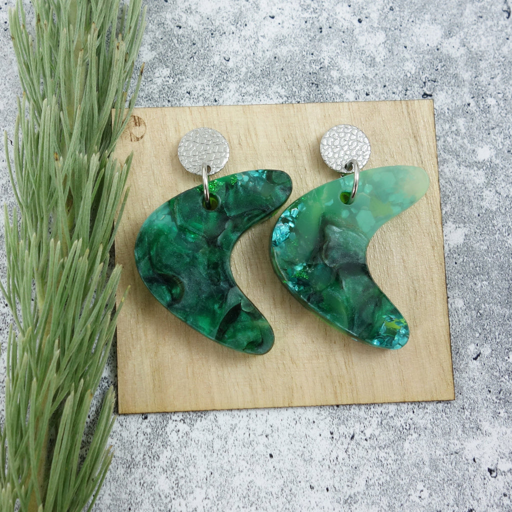 Mid century curve shaped one-of-a-kind recycled acrylic earrings with stainless steel toppers. 