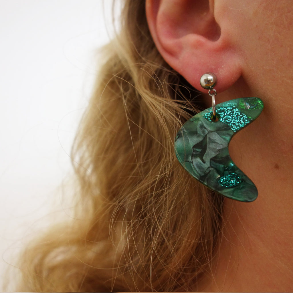 Mid century inspired curve recycled acrylic plastic earrings being modelled