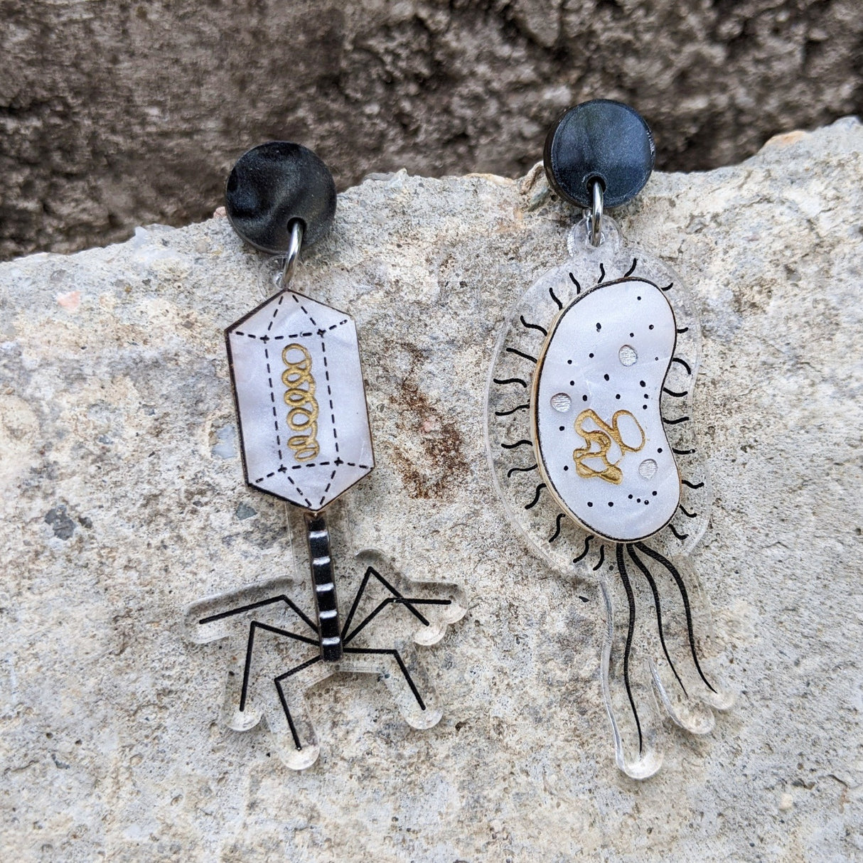 Asymmetrical Bacteria and Virus Laser Cut Acrylic Earrings closeup. 