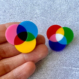 A pair of small subtractive and additive colour wheel brooches, laser cut in acrylic.